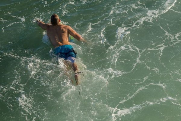 surfing-paddling-out